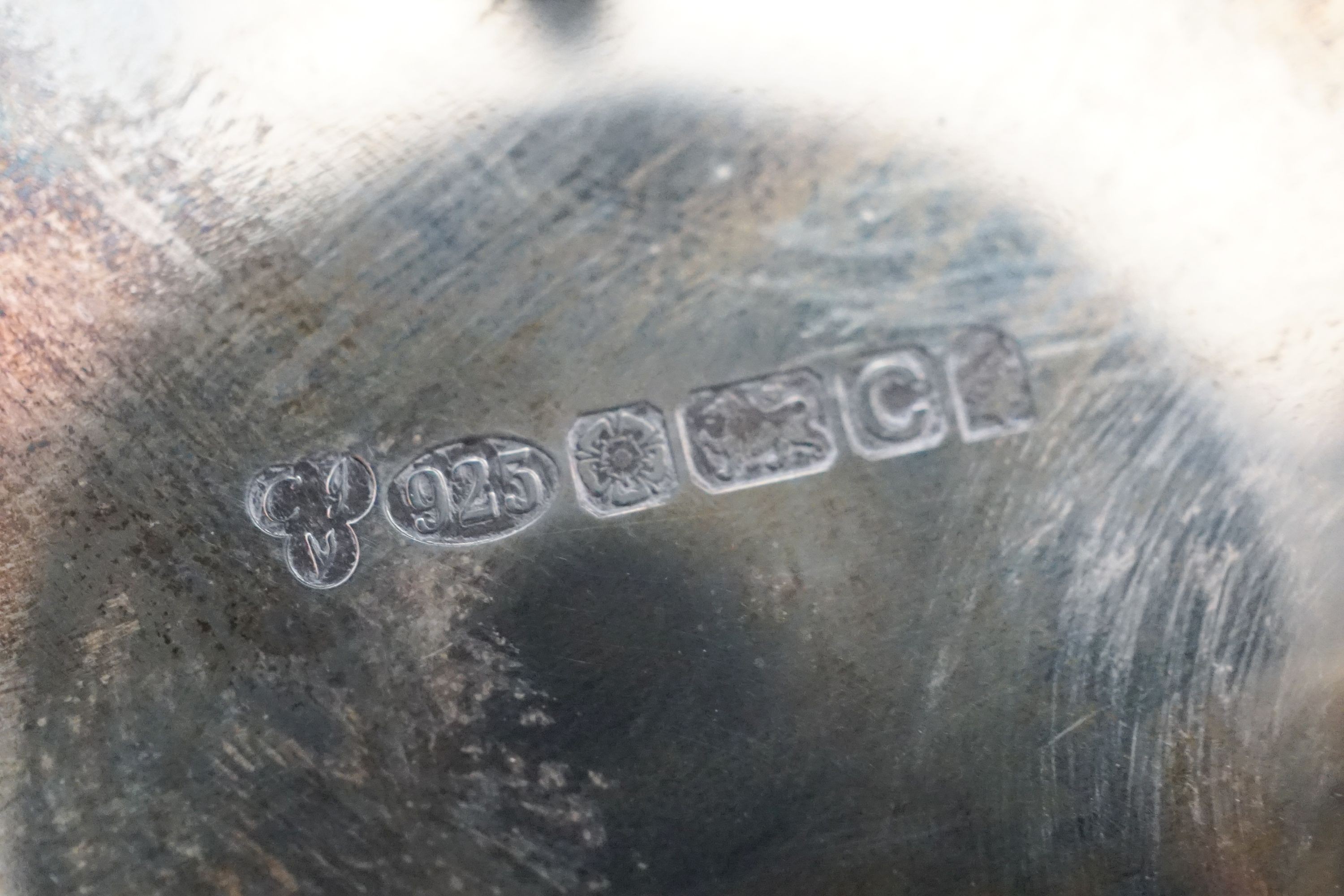 A modern pierced silver sweetmeat basket, 10cm and a similar pierced silver wine coaster.